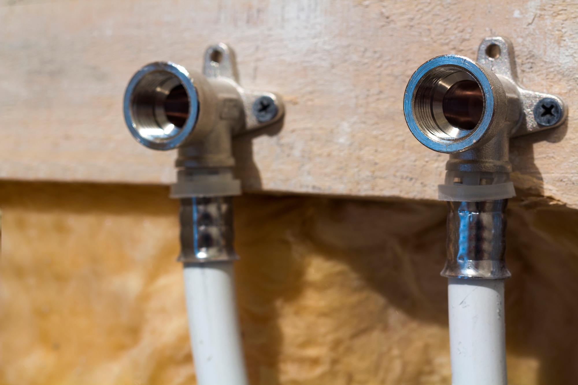 Water pipes made of polypropylene in the wall, plumbing in the house. Installation of sewer pipes in